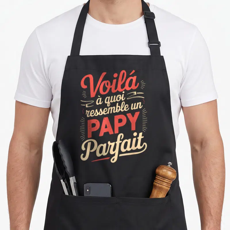 Tablier de cuisine noir avec l'inscription colorée Voilà à quoi ressemble un Papy Parfait en typographie vintage.
