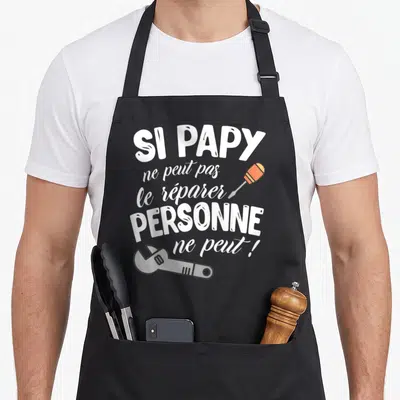 Tablier de cuisine noir avec inscription blanche Si Papy ne peut pas le réparer personne ne peut et illustrations d'un tournevis et d'une clé.