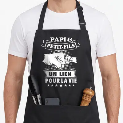 Tablier de cuisine noir avec illustration blanche poignets et texte Papi Petit-Fils Un Lien Pour La Vie.