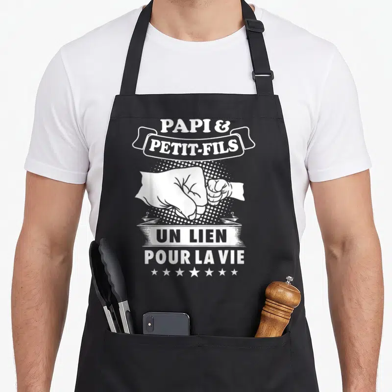 Tablier de cuisine noir avec illustration blanche poignets et texte Papi Petit-Fils Un Lien Pour La Vie.