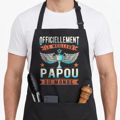 Tablier de cuisine noir avec un trophée aux ailes et le texte « officiellement le meilleur papou du monde » imprimé en bleu et orange.