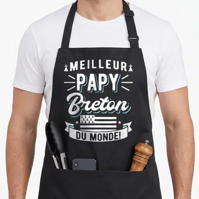 Tablier de cuisine noir avec inscription Meilleur Papy Breton Du Monde et drapeau breton stylisé.