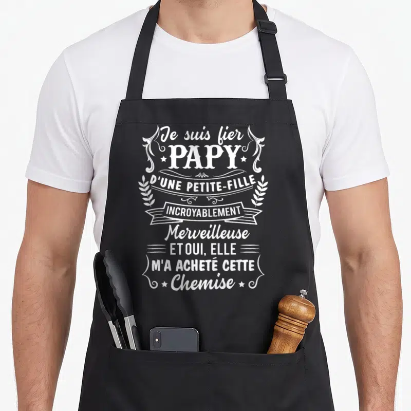 Tablier de cuisine noir avec inscription blanche Je suis fier Papy d'une petite-fille incroyablement merveilleuse et m'a acheté cette chemise.