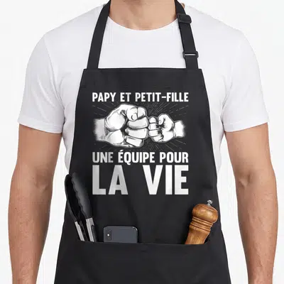 Tablier de cuisine noir avec illustration blanche de deux mains qui se serrent la poignée en signe d'alliance.