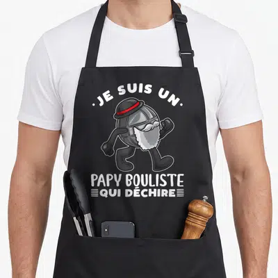 Tablier de cuisine noir avec illustration d'un boulard anthropomorphisé portant une barbe blanche et un chapeau noir à bande rouge.
