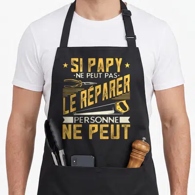 Tablier de cuisine noir avec inscription jaune et blanche sur le thème du bricolage de grand-père