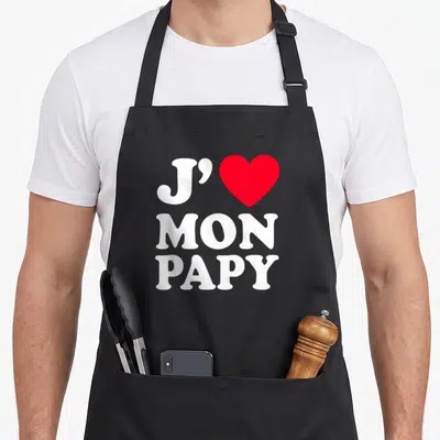 Tablier de cuisine noir avec l'inscription J'aime mon papy et un grand cœur rouge au centre.