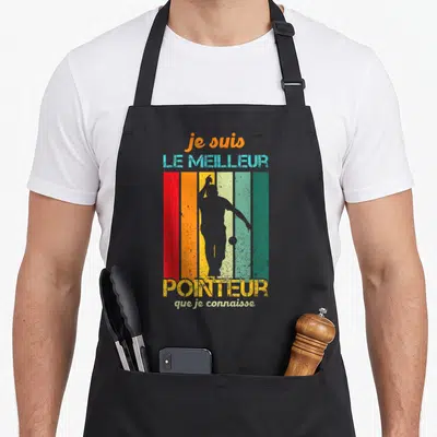 Tablier de cuisine noir avec silhouette de bouliste sur fond rayé multicolore et texte humoristique en lettres délavées.