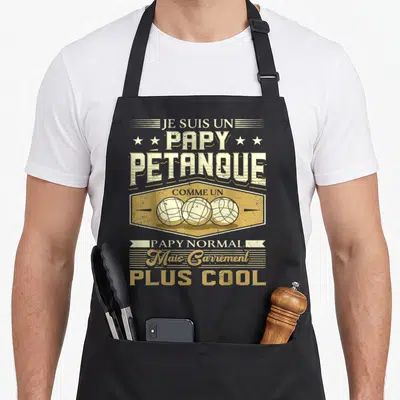 Tablier de cuisine noir avec illustration vintage de trois boccias et texte Je suis un papy pétanque plus cool.