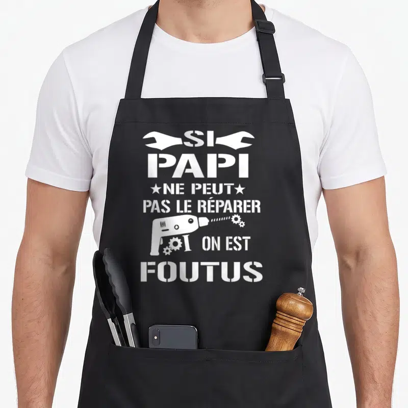 Tablier de cuisine noir avec inscription blanche Si papi ne peut pas le réparer on est foutus et une perceuse.