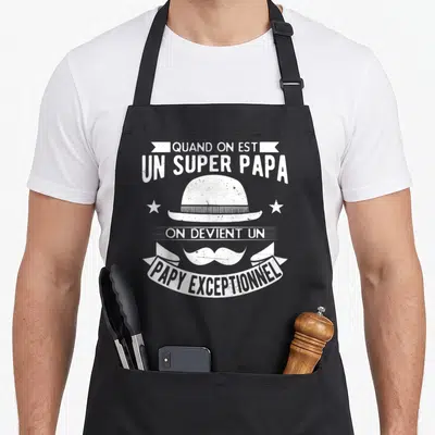 Tablier de cuisine noir avec illustration d'un chapeau melon, d'une moustache et du texte blanc Quand on est un super papa on devient un papy exceptionnel.