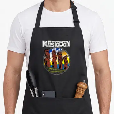 Tablier de cuisine noir avec quatre statues de Moaï rouges et le logo Mastodon en blanc au-dessus.