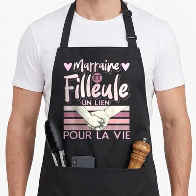 Tablier de cuisine noir avec inscription Marraine et Filleule Un lien pour la vie et illustration de deux mains se tenant.