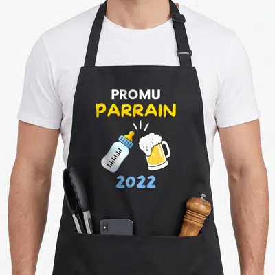 Tablier de cuisine noir avec illustration d'un biberon et d'une bière se touchant, texte Promu Parrain 2022