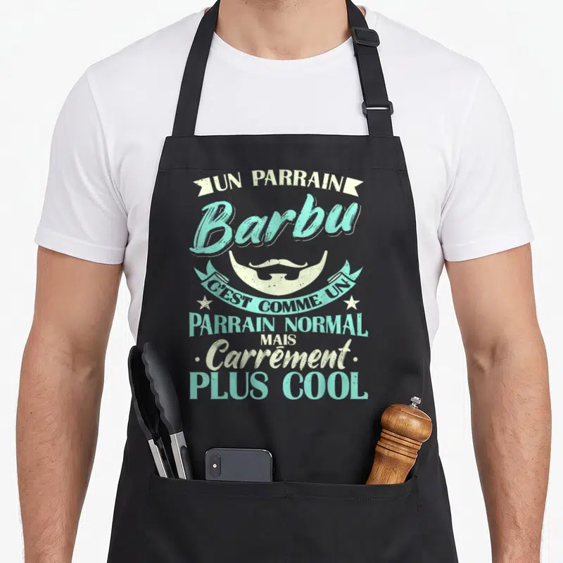 Tablier de cuisine noir avec typographie vintage turquoise et illustration de barbe blanche.