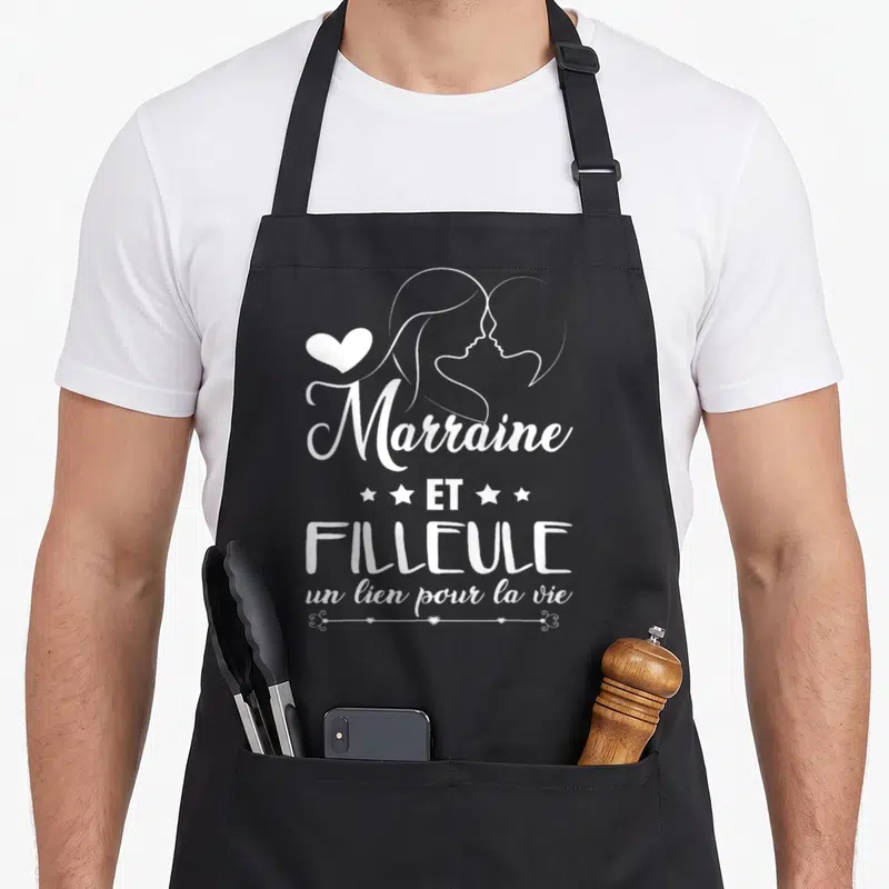 Tablier de cuisine noir avec inscription Marraine et Filleule un lien pour la vie et silhouettes féminines blanches.