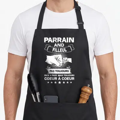 Tablier de cuisine noir avec illustration de poings et texte blanc Parrain and Filleul Coeur à Coeur