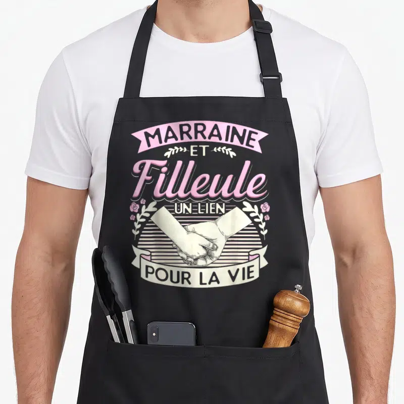 Tablier de cuisine noir avec illustration poignée de main et texte Marraine et Filleule Un Lien Pour La Vie en rose et gris.