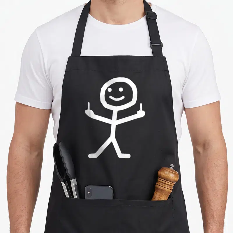 Tablier de cuisine noir avec bonbonhomme blanc souriant levant les deux en gesture d'insolence.