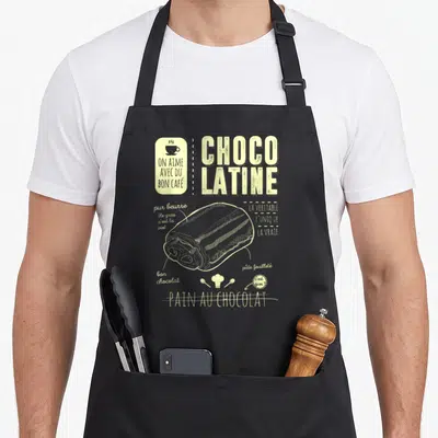 Tablier de cuisine noir avec illustration vintage d'un pain au chocolat et le texte Choco latine pur beurre bon chocolat.
