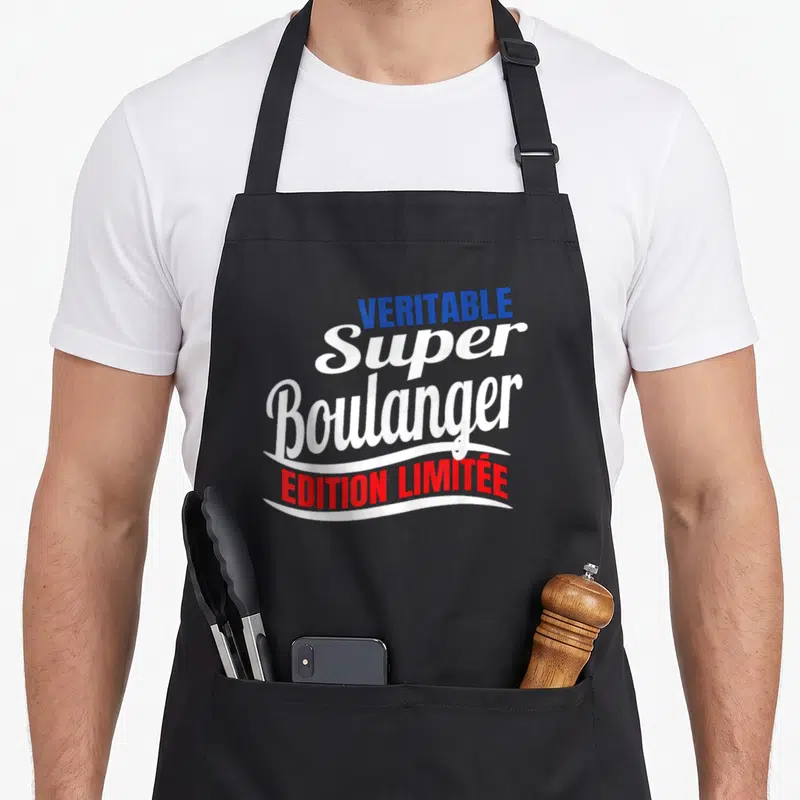 Tablier de cuisine noir avec l'inscription Véritable Super Boulanger « Édition Limitée » en typographie colorée.