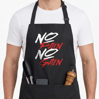 Tablier de cuisine noir avec l'inscription No Pain No Gain en typographie blanche et rouge stylisée.