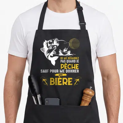 Tablier de cuisine noir avec illustration d'un gros poisson et du texte Ne me dérangez pas quand je pêche.