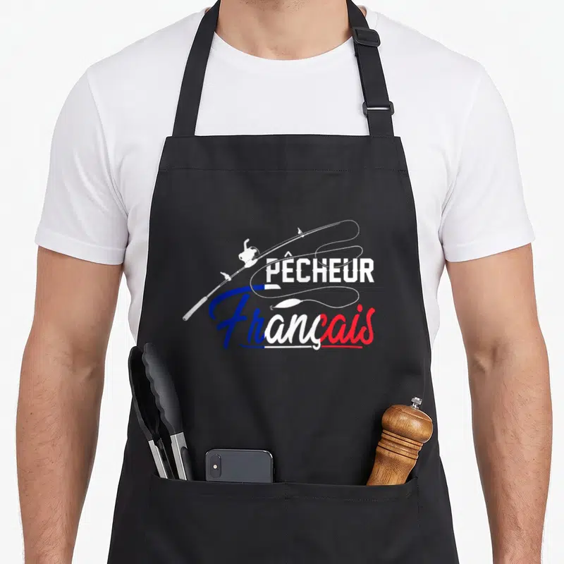 Tablier de cuisine noir avec une canne à pêche blanche et le texte Pêcheur Français aux couleurs du drapeau tricolore.