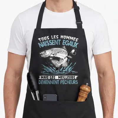 Tablier de cuisine noir avec une truite sautant et le texte Tous les hommes naissent égaux mais les meilleurs deviennent pêcheurs.