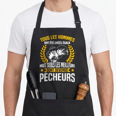 Tablier de cuisine noir avec illustration de brochet et texte humoristique sur la pêche en blanc et jaune.