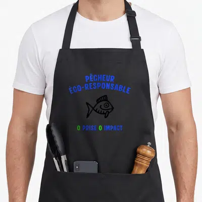 Tablier de cuisine noir avec illustration de poisson et texte Pêcheur « Éco-Responsable » 0 Prise 0 Impact en bleu et vert.