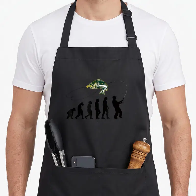 Tablier de cuisine noir avec silhouette évolutive transformée en pêcheur tenant une canne à pêche et un poisson sautant.