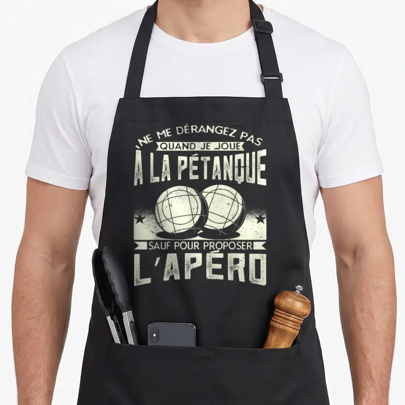Tablier de cuisine noir avec deux boules de pétanque et le texte Ne me dérangez pas quand je joue à la pétanque sauf pour proposer l'apéro