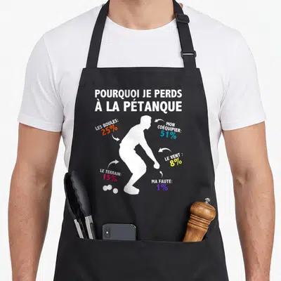 Tablier de cuisine noir avec silhouette blanc et texte coloré expliquant les raisons de perdre au jeu de boules.