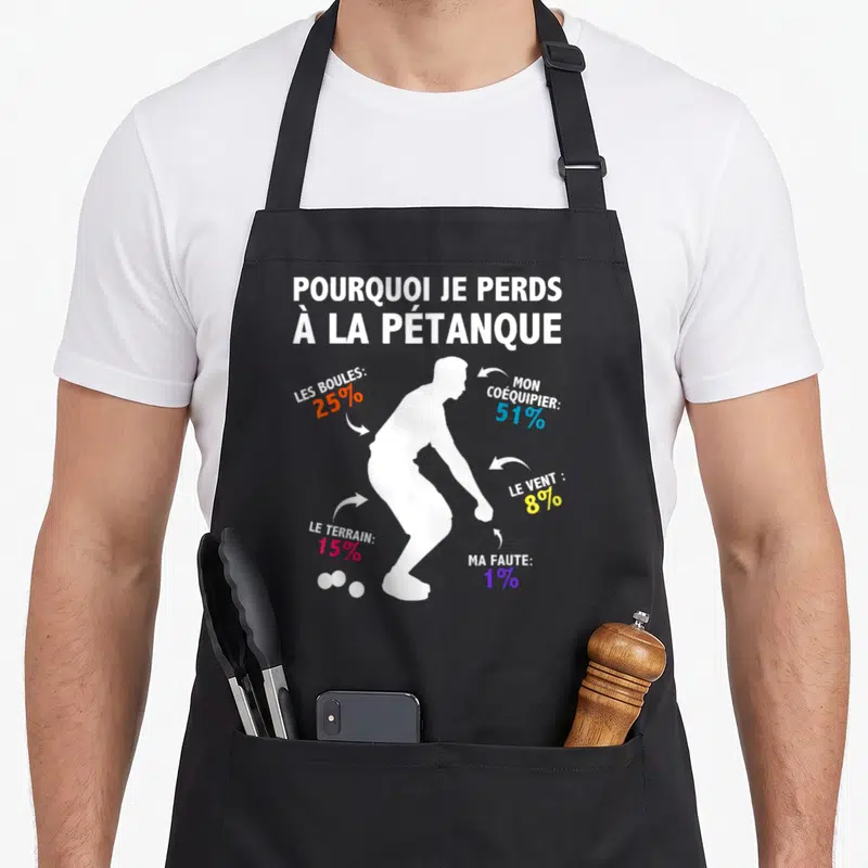 Tablier de cuisine noir avec silhouette blanc et texte coloré expliquant les raisons de perdre au jeu de boules.