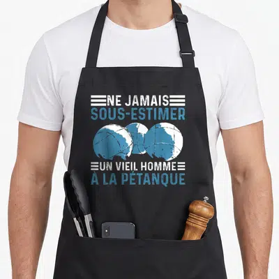 Tablier de cuisine noir avec trois boules de pétanque bleues et texte blanc et bleu.