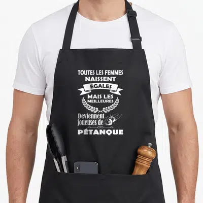 Tablier de cuisine noir avec inscription blanche sur la pétanque, couronne de laurels et balle stylisée en trajectoire.