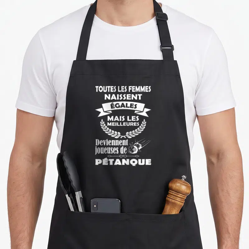 Tablier de cuisine noir avec inscription blanche sur la pétanque, couronne de laurels et balle stylisée en trajectoire.