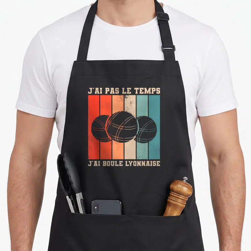 Tablier de cuisine noir avec trois boules de boule lyonnaise sur fond de bandes verticales orange et bleues.