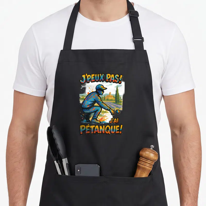 Tablier de cuisine noir avec illustration d'un joueur de pétanque et le texte J'peux pas J'ai Pétanque.