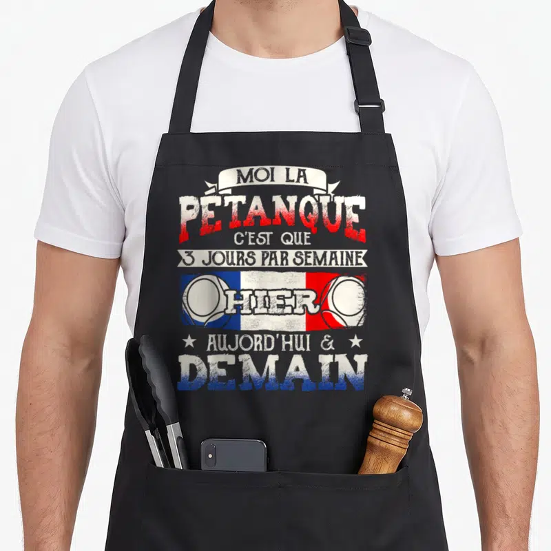 Tablier de cuisine noir avec inscription humoristique sur la passion de pétanque et drapeau français stylisé.