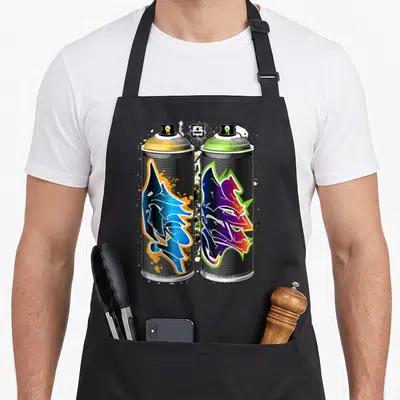 Tablier de cuisine noir avec deux bombes de peinture graffiti colorées et des éclaboussures artistiques.