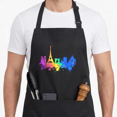 Tablier de cuisine noir avec skyline de Paris en aquarelle multicolore et peinture splash.