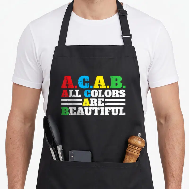 Tablier de cuisine noir avec l'inscription A.C.A.B. Toutes les couleurs sont magnifiques en lettres multicolores style graffiti.