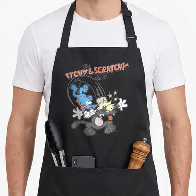 Tablier de cuisine noir avec le logo The Itchy & Scratchy Show et une illustration d'une souris bleue frappant un chat gris avec un marteau.