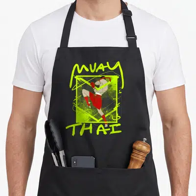 Tablier de cuisine noir avec illustration d'un combattant de Muay Thai en rouge et texte vert fluo.