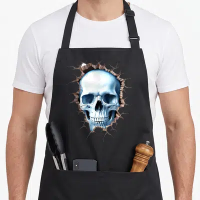 Tablier de cuisine noir avec un crâne bleu sortant d'un mur fissuré, style illustration abstraite.
