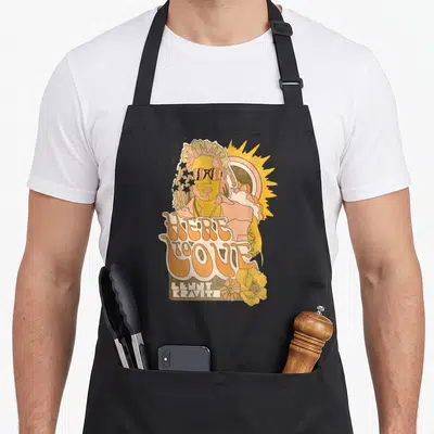 Tablier de cuisine noir avec illustration rétro Here To Love Lenny Kravitz soleil et fleurs orange