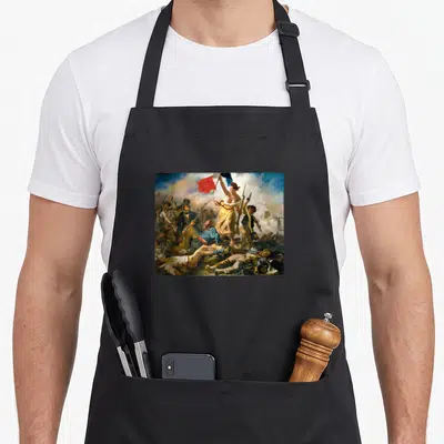 Tablier de cuisine noir avec reproduction de La Liberté Guidant Le Peuple en couleurs vives.