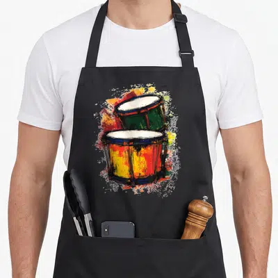 Tablier de cuisine noir avec illustration de deux tambours colorés au style graphique et éclaboussures artistiques.